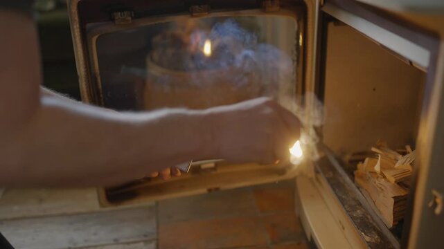 A person is opening a microwave oven and taking out a bag of chips. The bag of chips has a label that says "Caramelized."