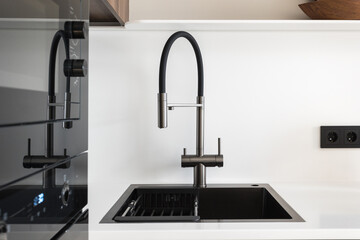 kitchen faucet on a stylish metal sink