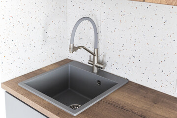 kitchen faucet on a stylish metal sink