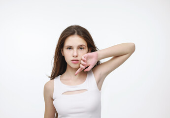 Fototapeta premium Portrait of a brunette in a white tank top.