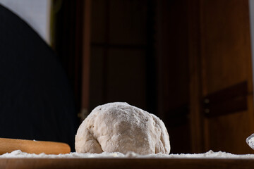 yeast dough on a wooden board. Fresh baked goods. Food. Bread. The concept of food