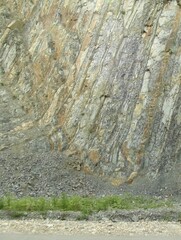 Steep drop of a stone rock.