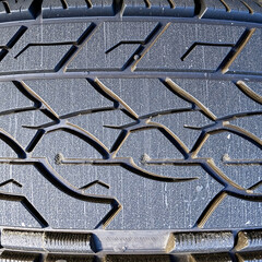 Weathered Tire Tread – Faded Rubber Surface with Dust and Cracks, Ultra Close-Up