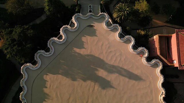 aerial view of parc guell, a landmark tourist attraction in Barcelona, Spain at sunrise, empty