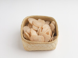 Heap of raw crackers on white background