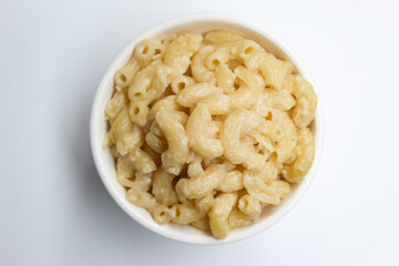 a bowl of macaroni and cheese pasta isolated on white background