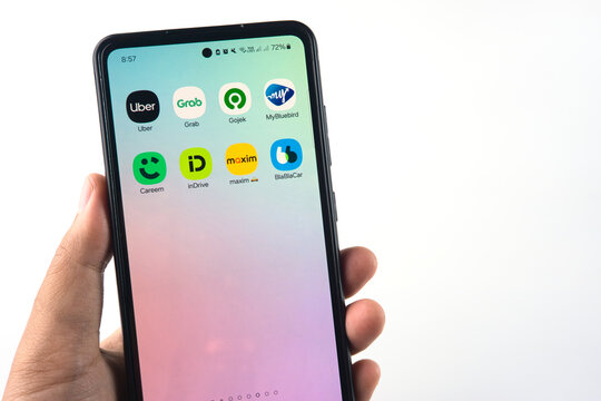 Smartphone Displaying Various Ride-Sharing and Transport Apps on Home Screen Such as Uber, Grab, Gojek, Careem, inDrive, Bluebird, Maxim, and BlaBlaCar on February 26, 2025 in Sleman, Indonesia
