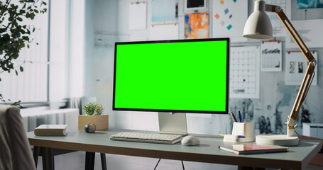 Modern Workspace Features Desktop Computer With Green Screen Chroma Key Display. Engineering,...