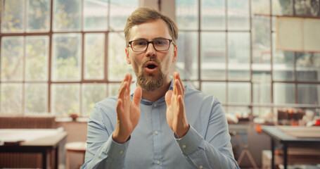 Stylish Creative Man Does Video Call from Home Office. Professional Talking to Business Partners, Associaets, Clients, Colleags via Online Conference Chat. POV from Camera