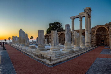 Sunset light over reconstructed columns of the ancient Athena Temple ruins in Side. Roman...