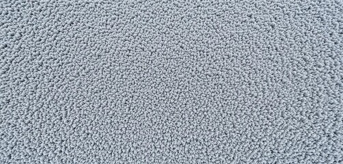 Smooth, slightly napped surface of short-pile gray carpet,  plush,  fiber