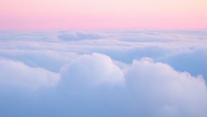 Fototapeta premium Aerial view of soft clouds under a pastel sky with pink and blue hues creating a dreamy atmosphere