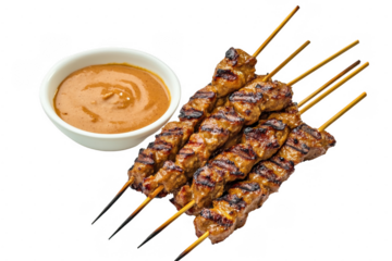 Grilled beef satay skewers with peanut sauce. Close up view of flavorful meat on wooden skewers, served with a side of creamy peanut dipping sauce. Delicious Asian cuisine.