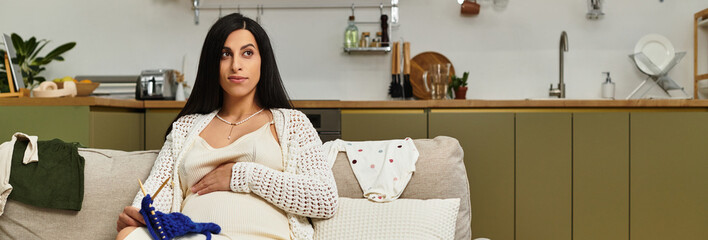 Expecting mother relaxing at home while knitting in a cozy living space