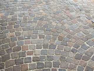 Intricate cobblestone pavement pattern with varied shapes and colors