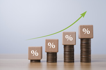 Business sales increase, Interest rates increase, Wooden blocks with percentage sign and arrow pointing up, Economic growth