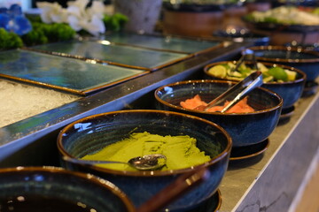 Assorted gourmet Japanese dishes elegantly presented. Culinary art and international cuisine. Wasabi Ginger Lime