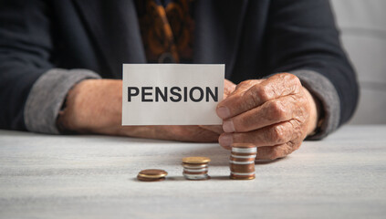 Elderly female with a Pension message and coins.