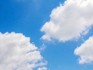 Obraz premium White clouds scattered in the clear blue sky. Sky and clouds landscape. Sky background