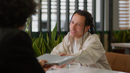 Two diversity business multiracial men businessmen in office talking papers documents research...