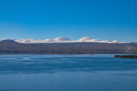 Lake Sevan and snow-covered Gegham ridge mountains scenic view in autumn (Gegharkunik Province, Armenia)