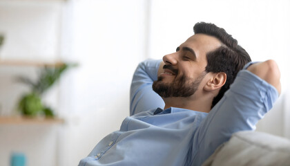 Relaxed Young Man Smiling on Couch