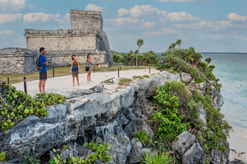 Tulum, Mexico, Dec 2019. Temple of the Stela, the name of a Mayan engraved monolith, a large stone portrays in low relief a standing Maya lord, with inscription in Mayan hieroglyphs. 