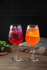 Side view on two glasses of fresh cocktails with ice