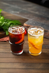 Side view on two glasses of fresh lemonades with ice