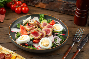 Portion of gourmet nicoise salad with tuna fish and eggs