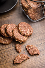 Sweet oatmeal cookies on wooden table.