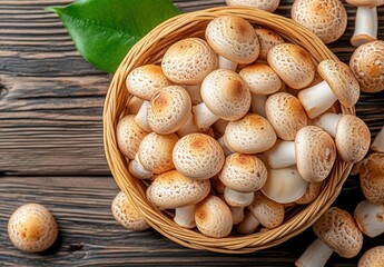 A freshly harvested basket filled with soft, white, button mushrooms showcasing their delicate textures and earthy tones, perfect for cooking and garnishing dishes.