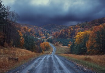 A Serene Autumn Landscape: A Winding Road Through Colorful Forests and Rolling Hills Under Dramatic Skies in Late Fall