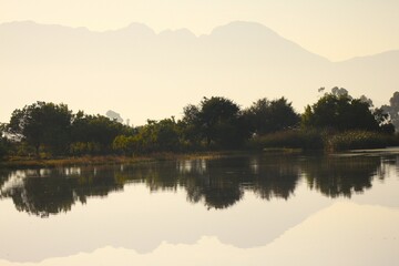 morning on the lake with mountain reflection