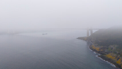 Yavuz Sultan Selim Bridge Istanbul Turkey Misty coastal view with a bridge in the distance. A...