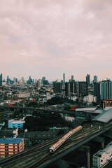 Aerial night cityscape panorama of Bangkok with urban architecture and illuminated downtown skyline 