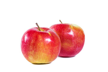 Whole shiny juicy red apples isolated on white background.