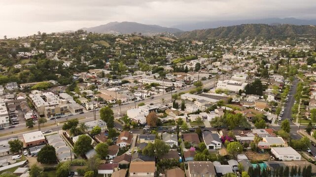 drone of suburban area near Pasadena and Glendale in Los Angeles with mountains in the distance