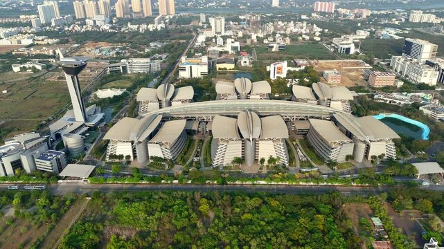 This is an aerial view of the TCS Siruseri campus in Chennai, IT facility within the SIPCOT IT Park in Siruseri. featuring several interconnected buildings and a distinctive tall tower.
