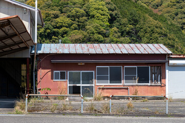 An abandoned, dilapidated and vacant house in rural Japan (Akiya in Japanese) where rural areas...