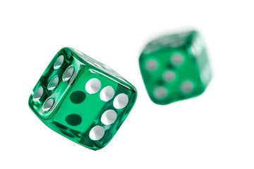 Pair of vibrant green dice rolling dynamically isolated on transparent background