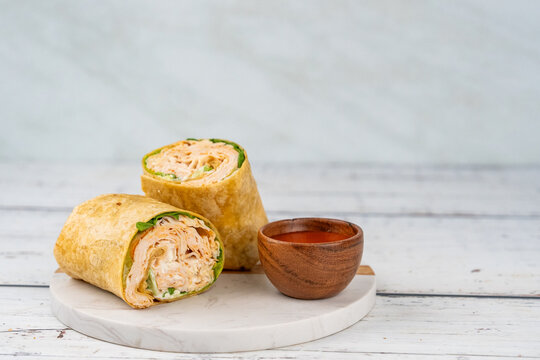 Chicken buffalo wrap sandwich with sauce 