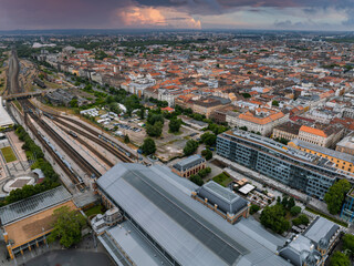Aerial view of Budapest, Hungary, featuring a large railway station with a glass and metal roof,...