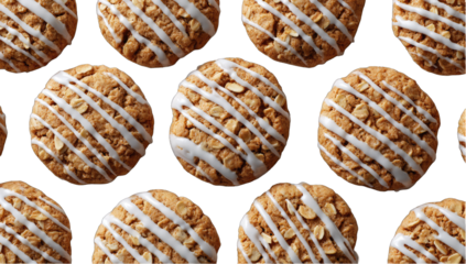 Many round, light-brown cookies, topped with white icing and oat pieces, arranged in a grid pattern
