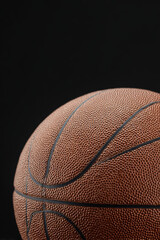closeup of basketball on clean ultrabright background emphasizing intricate texture of ball