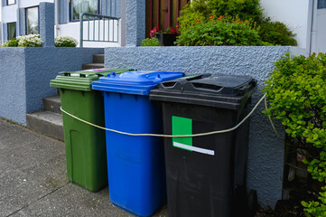 Colorful Recycling Bins for Waste Sorting Outside Residential House. Eco-Friendly Waste Separation System in Iceland.