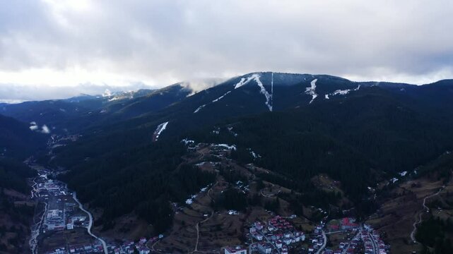 Establishing aerial footage of a small town in the mountains