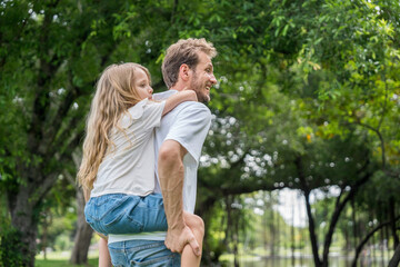 Fototapeta premium Happy family parent children having picnic outdoor activity. Enjoy happiness moment summer playing together including father mother son and daughter relaxing in the morning sunrise.