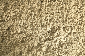 Beige cement textured surface as background, closeup