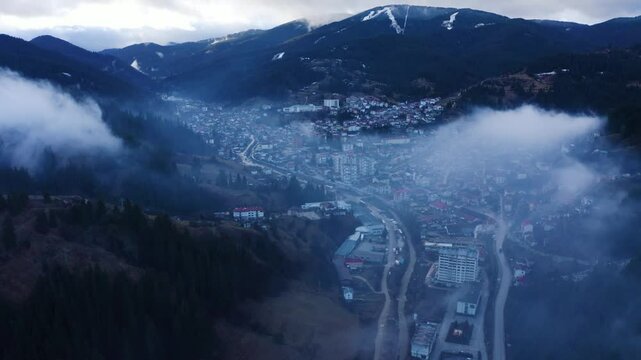 Establishing aerial footage of a small town in the mountains